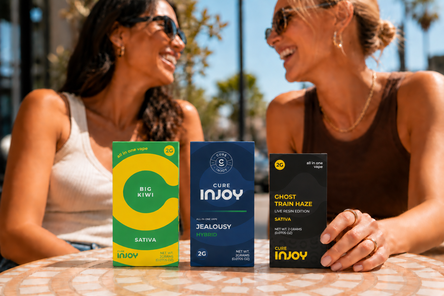 Cure Injoy Essentials and Legacy boxes beside a smaller Live Resin box
